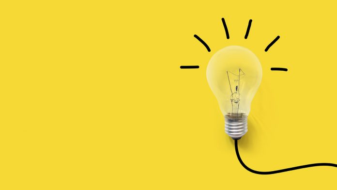 Creative thinking ideas brain innovation concept. Light bulb on yellow background